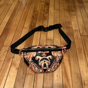 Gold and black sprayground Fanny pack